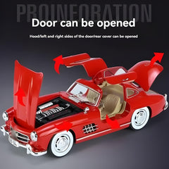 Red model car with open doors and hood on a dark background