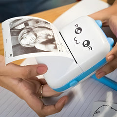 Small printer with cartoon face holding a photo of a woman's face on lined paper.