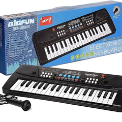 Electronic keyboard with microphone in front of its packaging