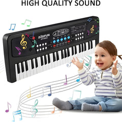 Child playing a toy keyboard with musical notes and 'High Quality Sound' text.