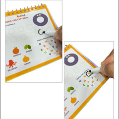 Educational book with letter tracing activity, held by a hand with a pen.