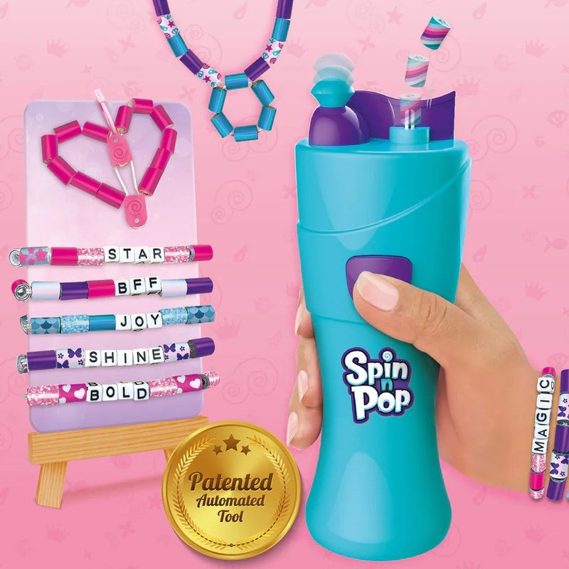 Spin 'n Pop toy with colorful pens and accessories on a pink background