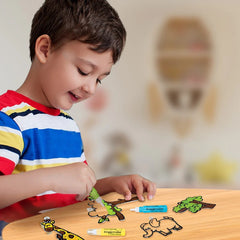 Child playing with craft materials on a table