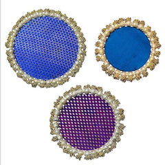 Three circular coasters with decorative frames on a white background