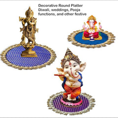 Decorative round platters with statues on a white background