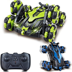 Toy vehicle with green and black design, remote control, and another vehicle with blue and black design on a white background.