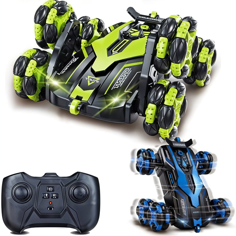 Toy vehicle with green and black design, remote control, and another vehicle with blue and black design on a white background.