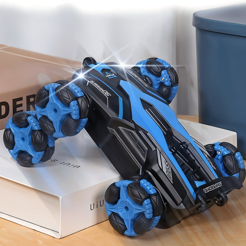 Black and blue handheld massager on a wooden surface with a blurred background