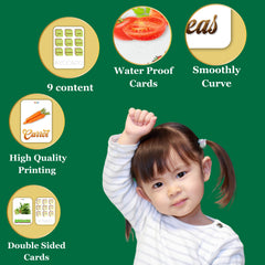 Child with educational cards on a green background