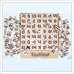 Wooden letter blocks with brown letters and Todfod branding on a light blue background