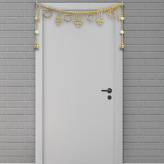 Decorative gold door arch on a gray brick wall