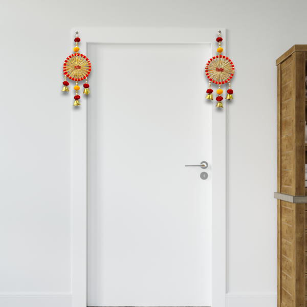 Decorative hanging with colorful elements on a white door.