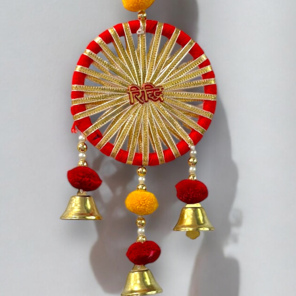 Decorative wall hanging with red, gold, and yellow colors on a white background