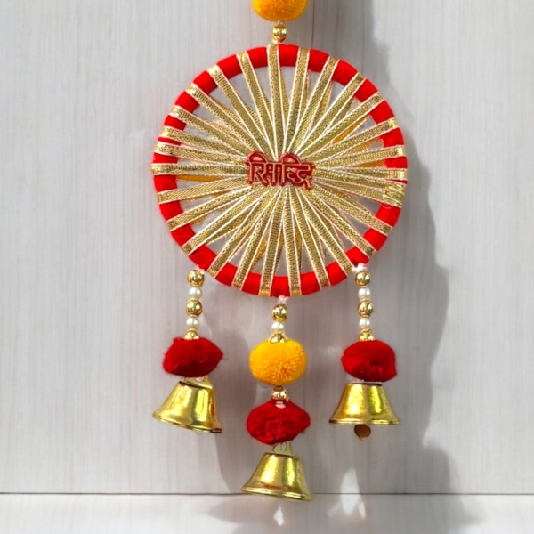 Decorative wall hanging with red, gold, and yellow colors on a white background