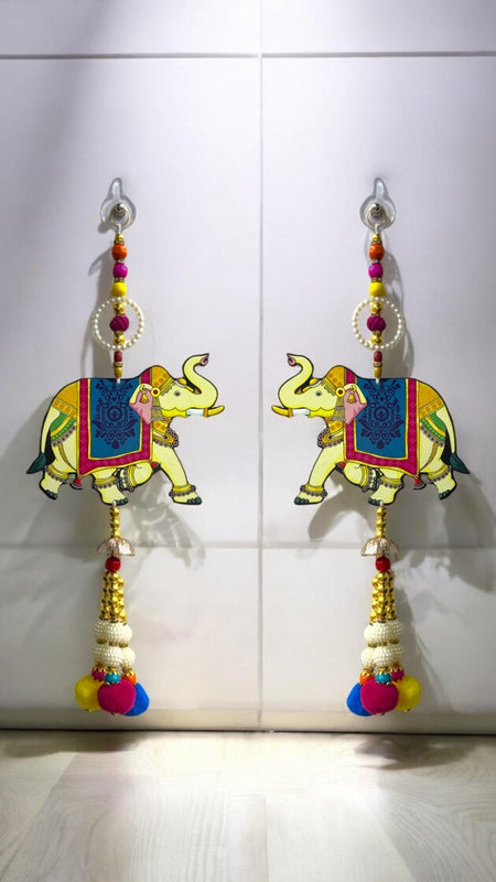 Colorful elephant earrings with decorative elements on a white background