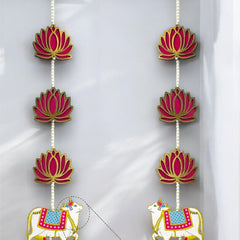 Decorative hanging with cows and lotus flowers on a white background