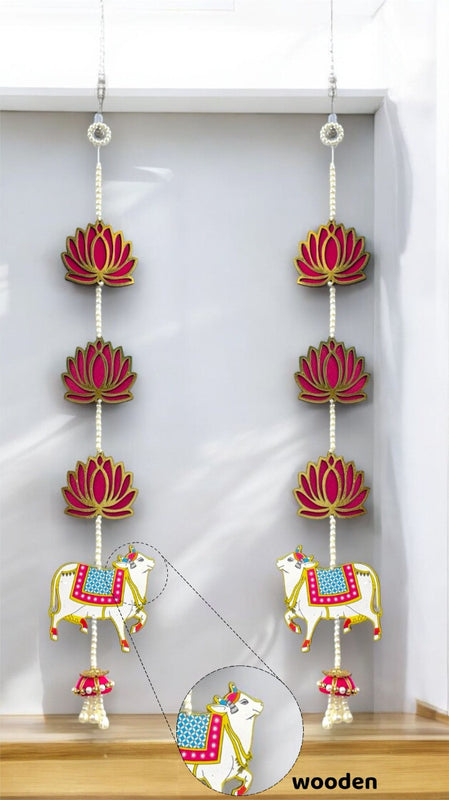 Decorative hanging with cows and lotus flowers on a white background