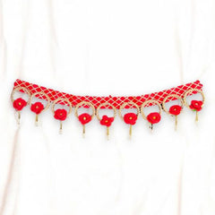 Red beaded necklace on a white background