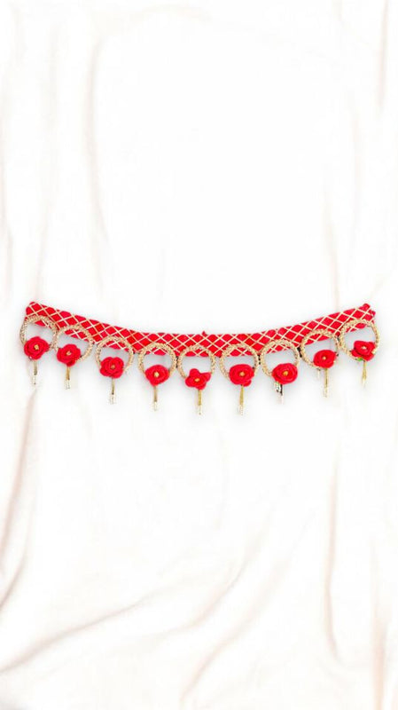 Red beaded necklace on a white background