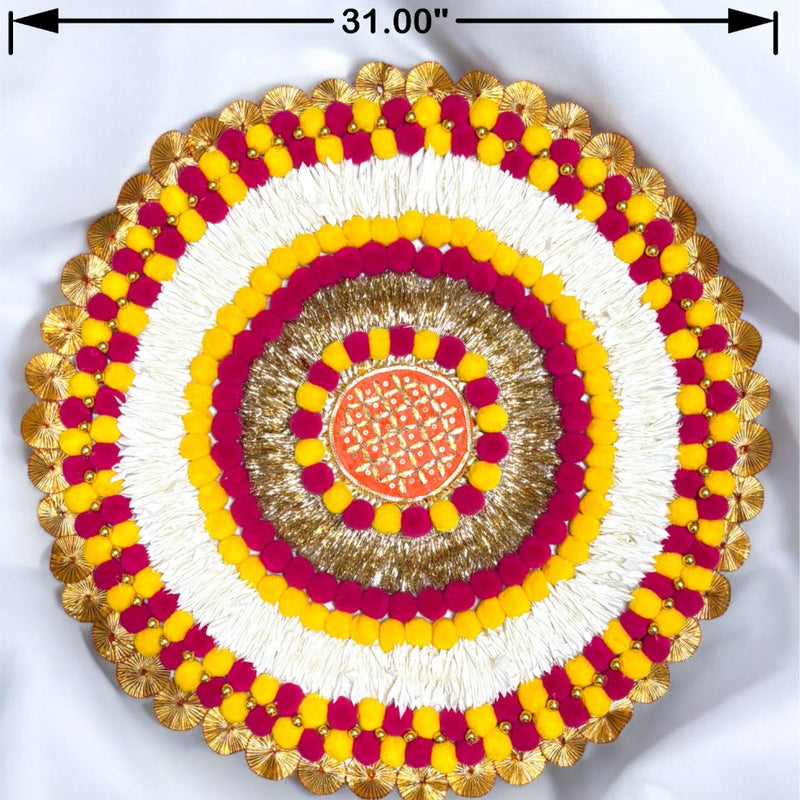 Decorative round item with concentric circles of yellow, red, and gold on a white background.