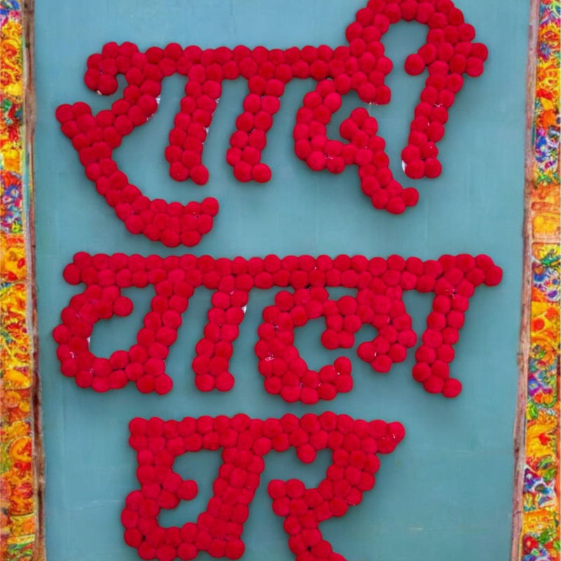 Red text on a blue background with a colorful border