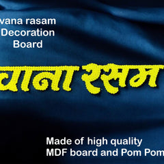 Decorative board with yellow text on a blue fabric background, featuring branding and product details.