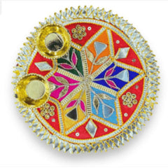 Decorative round object with colorful patterns and gold accents on a white background