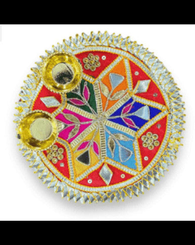 Decorative round object with colorful patterns and gold accents on a white background