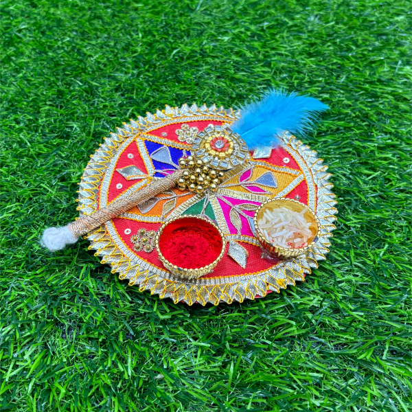 Decorative item with colorful patterns on a green grass background