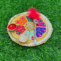 Decorative round object with colorful patterns on a grass background