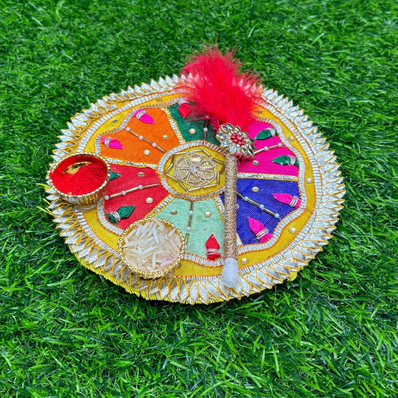 Decorative round object with colorful patterns on a grass background