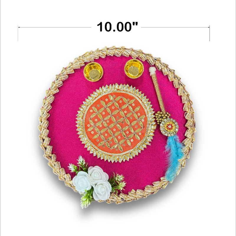 Decorative pink plate with gold rim, floral elements, and a measurement label on a white background