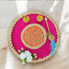 Decorative Kumkum Thali with pink center and gold border on a white background