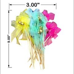 Colorful decorative sticks with ribbons and measurements on a white background