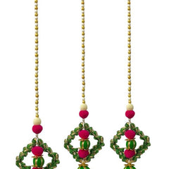 Set of three decorative hanging earrings with green, pink, and gold elements on a white background.