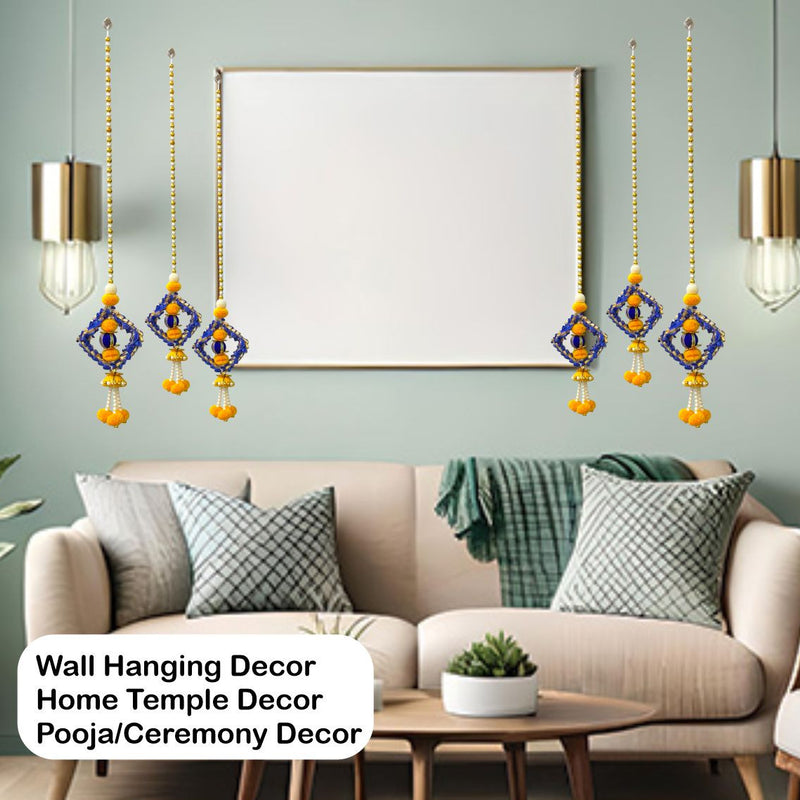 Living room with wall hanging decor, sofa, and framed artwork.