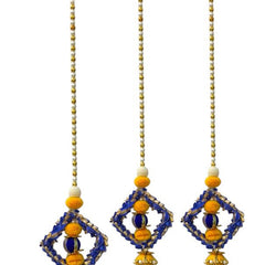 Three decorative hanging ornaments with blue, yellow, and white beads on a white background