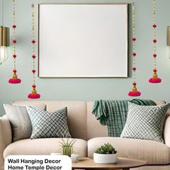 Living room with wall hanging decor, sofa, and framed artwork.