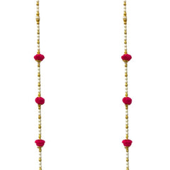 Long pink earrings with gold and red beads on a white background