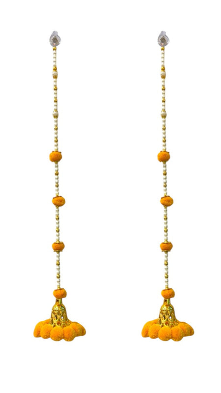 Pair of yellow floral earrings with gold accents on a white background
