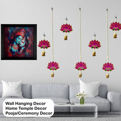Wall hanging decor with lotus designs and a framed painting above a sofa.