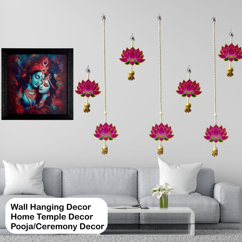 Wall hanging decor with lotus designs and a framed painting above a sofa.